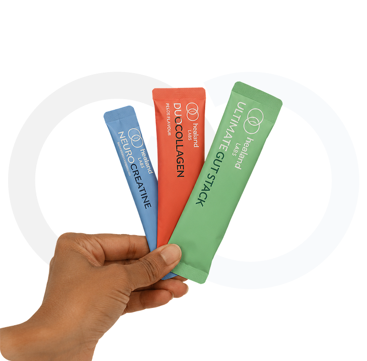 Hand holding NeuroCreatine, Duo Collagen and Ultimate Gut Stack sample sachets